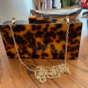 Black and tan acrylic clutch